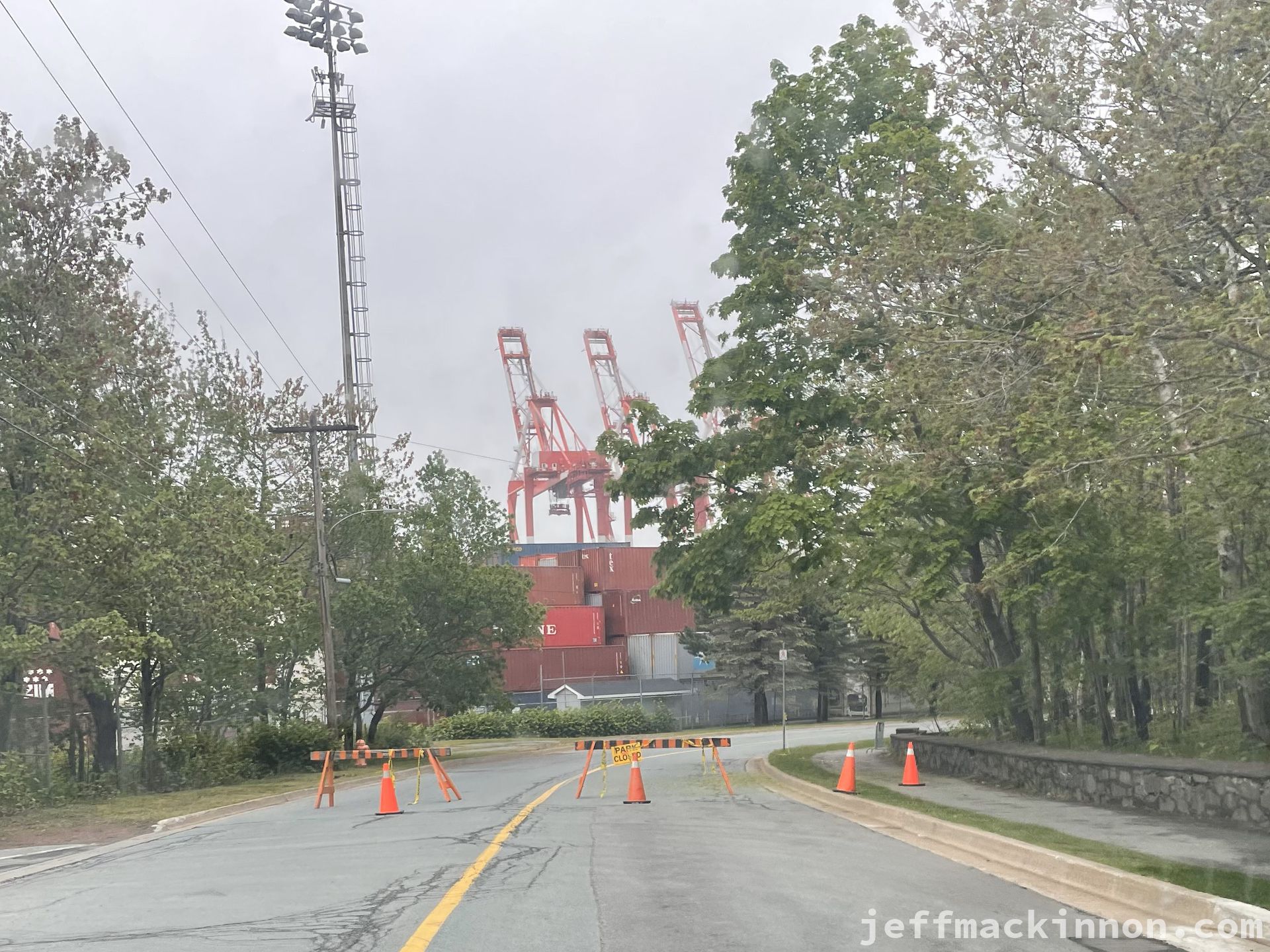 road with a barricade stating that the park is closed.