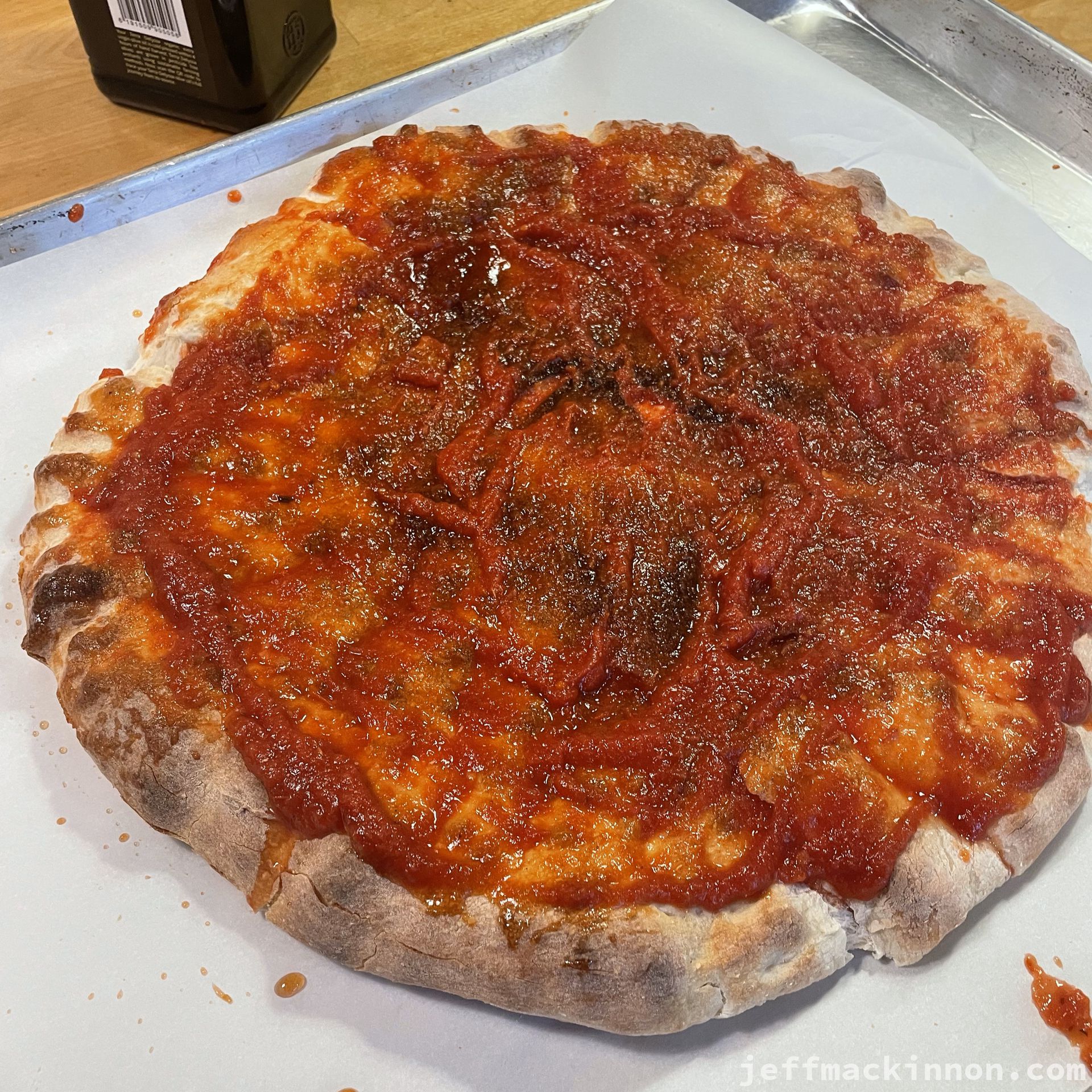 the same pizza dough, but flattened with sauce.