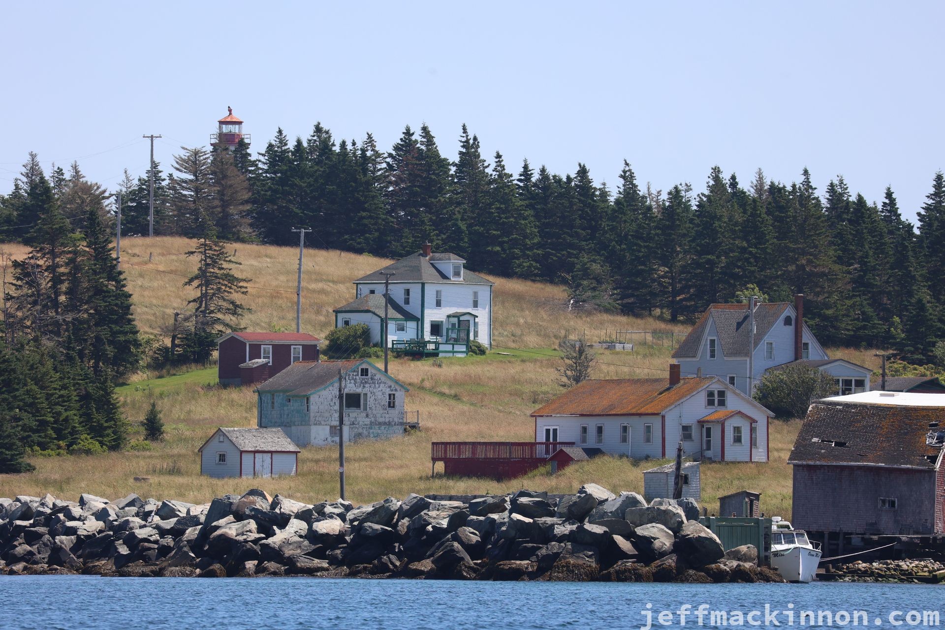 A small group of houses on a rugged island