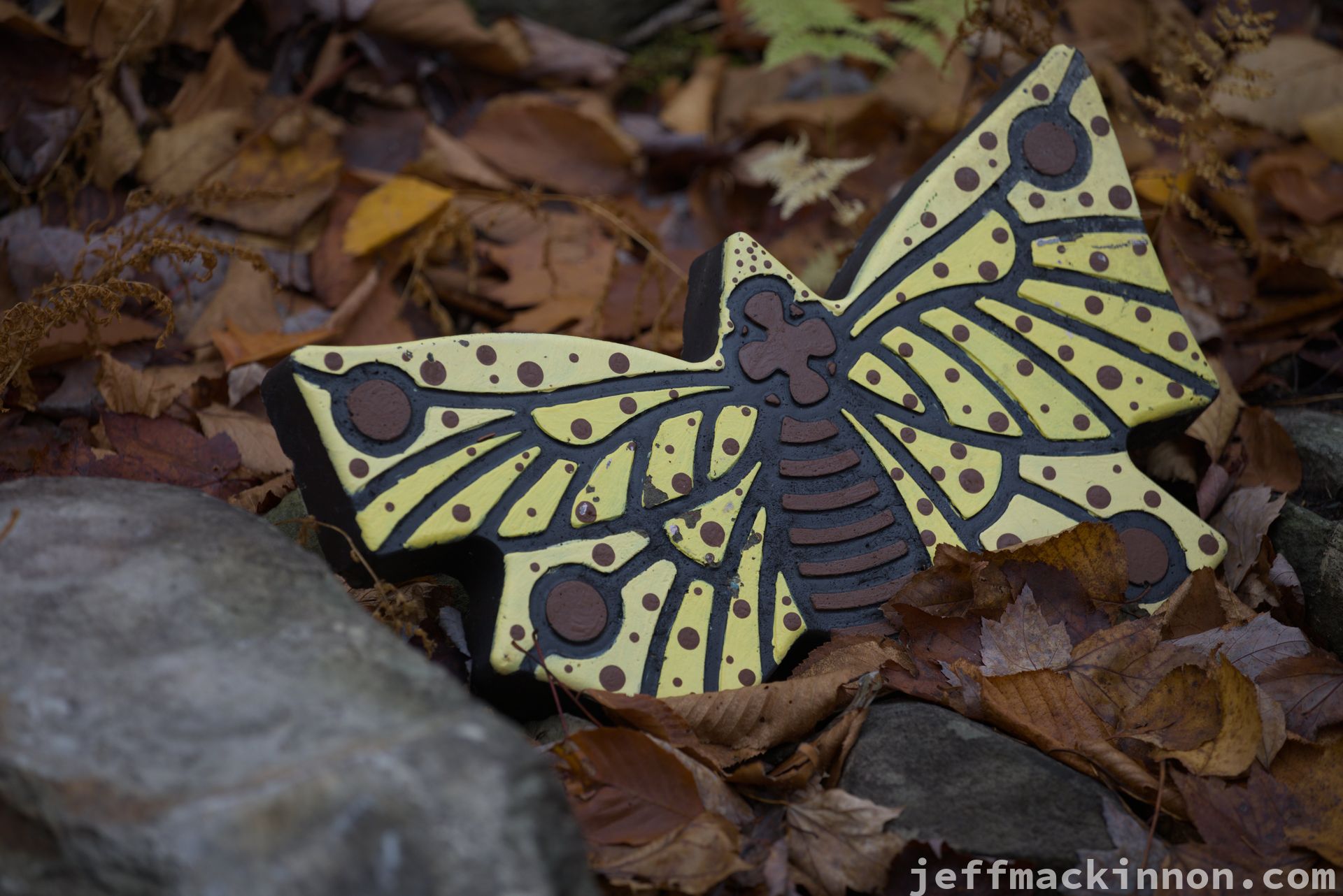 A butterfly made out of pottery or ceramic